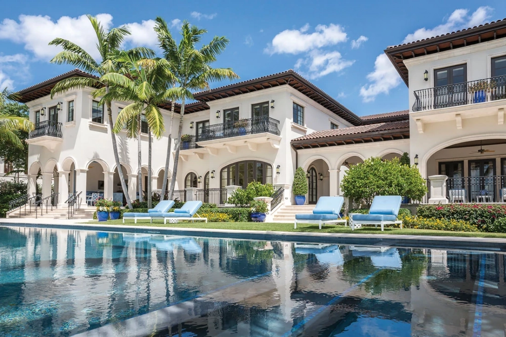Waterfront Coral Gables estate with palms and a pool